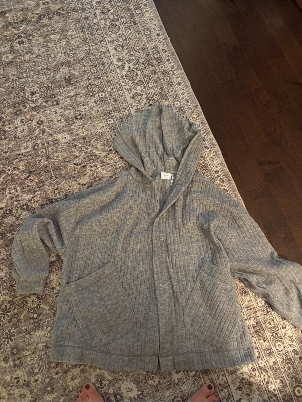 out from under cardigan